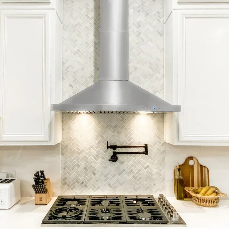 Kitchen range and stainless steel ventilation hood